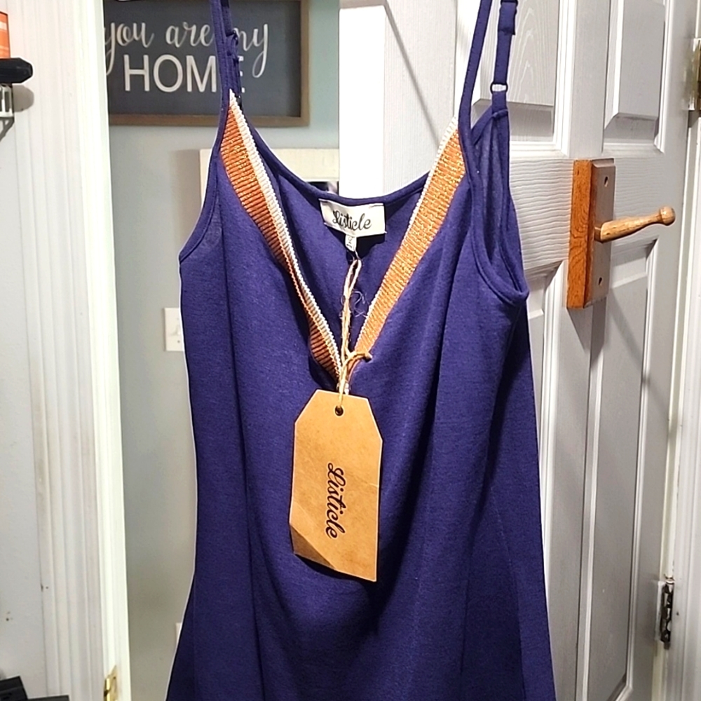 Listicle size Large tank top, deep purple with gold and tan glittery trim....